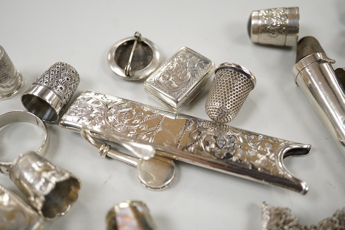 A Victorian silver vinaigrette, Edward Smith, Birmingham, 1848, 27mm, a collection of thimbles including some silver and sundry other items including pencils, child's rattle, button hooks, silver pocket watch, silver Ala
